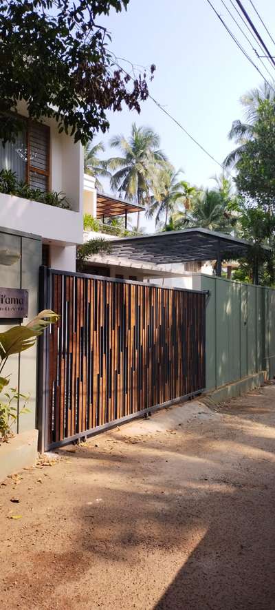 #Architect  #architecturedesigns  #industrialdesign  #wooden gate  #woodface #keralaplanners