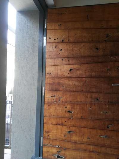 metal front door finished with wood
 #FrontDoor  #Veneer #officeinteriors  #DoorDesigns