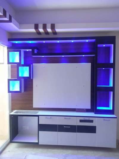 Tv panel with spacious cabinets and in built lightning. #tvpanel  #LivingRoomTVCabinet  #tvunitdesign  #woodendesign  #lights  #lightingdesign