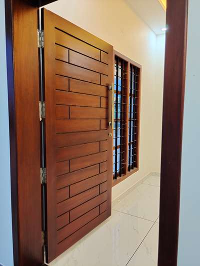 #Front Door Design🪵🪵
 #HomeDecor 
 #keralahomeplans 
 #FrontDoor 
 #elevation 
 #HouseConstruction
 #architecturedesigns 
 #ContemporaryHouse
 #InteriorDesigner