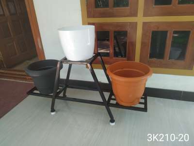 METAL STAND FOR INDOOR PLANTS.
 
Durable, Eco friendly. Rest free, Not harmful for any floor, Adjustable legs for leveling.