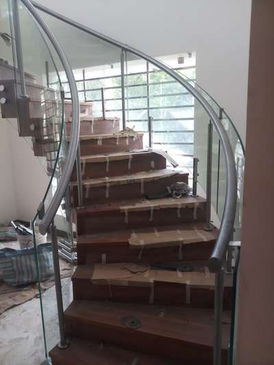 *Bend glass staircase*
Spiral staircase. ( approximate rate. )