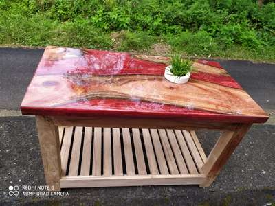 Sold out!! We make custom epoxy and wood clocks and tables according to the client's demand.
Mahogany Wood and a Metallic Red pigment here with size 3 feet by 1.5 feet and custom made legs finished to a satin look. 

 #LivingRoomTable  #CoffeeTable
 #InteriorDesigner #epoxytables 
 #keralaarchitectures  #HomeDecor #homedecoration 
 #DiningTable