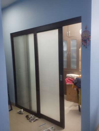home prayer room siliding door in wood and toughened glass.