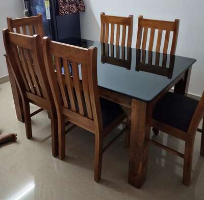 *Dining table and chairs*
mahagony wood
size 5*3
12 mm black glass top.
chairs 6 nos