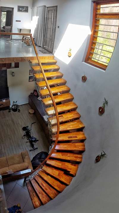 #StaircaseDecors #GlassStaircase #StaircaseDesigns #StaircaseIdeas #CurvedStaircase #WoodenStaircase #GlassHandRailStaircase #Architect #architecturedesigns #InteriorDesigner #Architectural&Interior #architecturekerala #archkerala #architecturedaily #archidaily #archidgestindia #homeinteriordesign #homeinteriorsdesign #Kannur #kannurinterior #kannur_logam #keralastyle #KeralaStyleHouse #keralaarchitectures #ContemporaryHouse #contemporary #ContemporaryDesigns #contemporaryart #HomeDecor #interiordecor #interiorinspiration #HouseIdeas #interiorideas #CurvedStaircase #architectsinkerala  #benchmarkarchitectskerala
