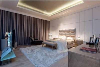 #Designer Fully Furnished Luxurious Bedroom with Back Wall Cladding, Remote Curtains, Fall Celing with Ambient Lighting, Chester with Oval Looking Glass, Recliner, LED Tv etc.