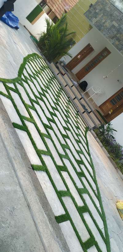 Natural stone with synthetic grass.  #naturalstonedesign  #LandscapeIdeas