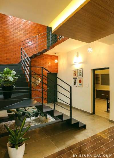 #stupacalicut #architecturedesigns #Architect #calicutdesigners #StaircaseDesigns #WallDecors #WoodenFlooring #IndoorPlants #KeralaStyleHouse