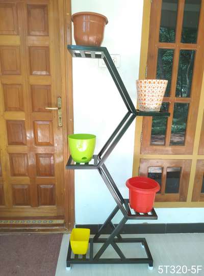 Metal Stand for indoor plants. 
Durable, Eco friendly, Rest free, Not harmful for any floor, Adjustable legs for leveling.