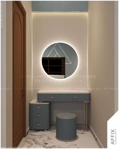 This dressing area is all about understated elegance. The round, glowing mirror and muted blue shades create a peaceful environment, ideal for unwinding and getting ready. A functional design that’s beautiful and minimal, making it the perfect addition to the bedroom." #Architect  #architecturedesigns  #Architectural&Interior  #architecturekerala  #architecturedaily  #best_architect