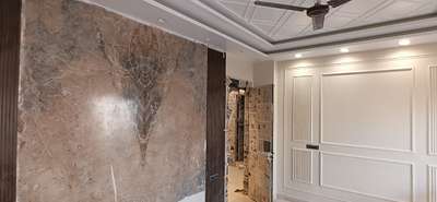work with booked match tiles on wall and moulding work

BY BUILD INNOVATION ARCHITECT ENGINEERS INTERIORS