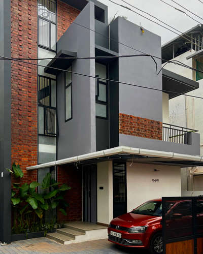 A compact urban residence defined by exposed brick, clean grey volumes, and bold geometric lines. A warm, contemporary home crafted for seamless city living.
Client: Staish Madhavan | 1530 sqft | 4 Bedroom Residence
#Architecture #ResidenceDesign #ContemporaryHome #BrickFacade #ModernArchitecture #UrbanLiving #ArchitecturalDesign #MinimalDesign #koloprojects
