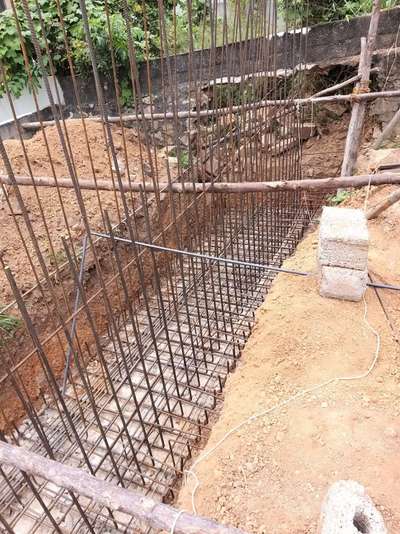 Placing steel in the retaining wall.