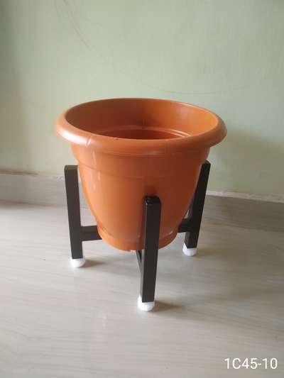 METAL STAND FOR INDOOR PLANTS.
 
Durable, Eco friendly. Rest free, Not harmful for any floor, Adjustable legs for leveling.