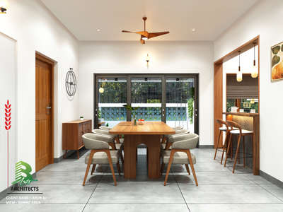 This dining space blends modern lines with warm textures, opening seamlessly to the outdoors and the breakfast counter for a refreshing, connected living experience.

Client :Arun aj
