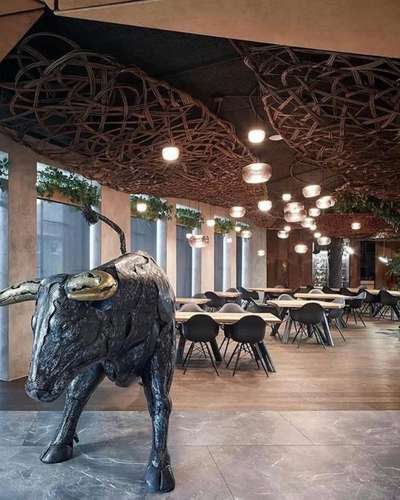 STK Restaurant in Olomouc, Czech Republic
Architects: Komplits
Principal Architect: Pavel Kříž
Year: 2019
Carpet area: 320 Sqm (3450 Sft)

Materials:
Basalt | kitchen floor
Oak | restaurant floor
Oak | tables
Willow branches | weaves
Cowhide | dropped ceiling
Steel tubes | tables
Rebars
Plants
Steel + brass | bulls


#worldarchitecture #interiordesign #architecture #decor #furniture #luxury #designer #handmade #inspiration #furnituredesign #style #designinspiration #wallpanel #sustainable #indoorplant #ShibariLight #restaurant #organic #organicinterior #greeninterior #organicdesign