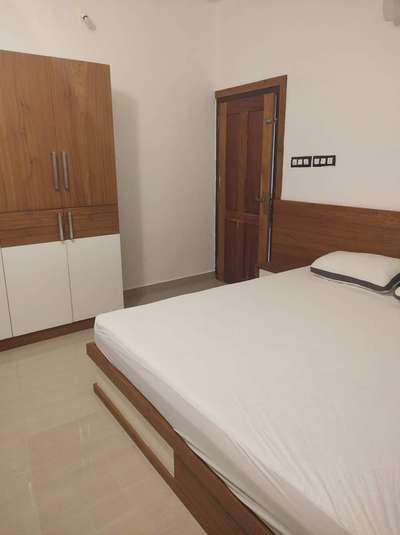 Mr Sreejith
Guest Bedroom 
Bestwood brand PVC foam board (multiwood) with teak and White combination