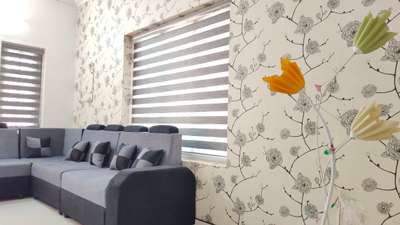 wallpaper and window blinds, along with sofa,. grey and white is a deadly combination