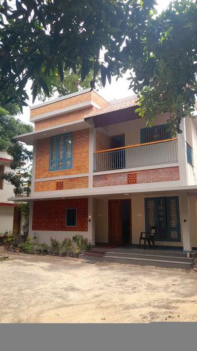 2400 sqft earthy toned residence completed in Dec 2023, Karunagappalli, Kollam ❣️ cost of construction: 40 lakhs