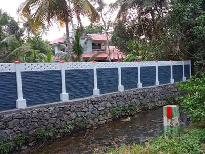 precast compound wall above rubble masonry.