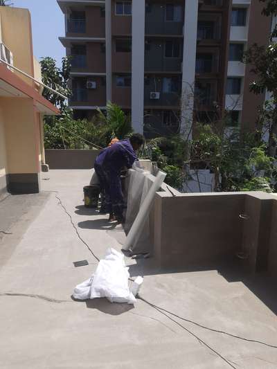 On Parapet , installing mat for waterproofing work