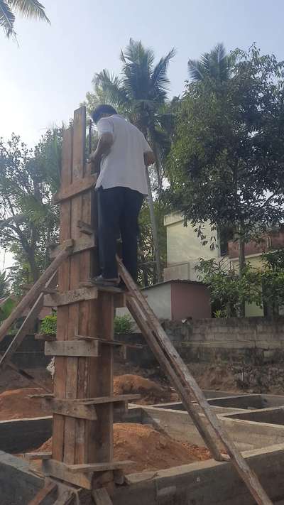 Inspecting the curing work after column concrete pouring