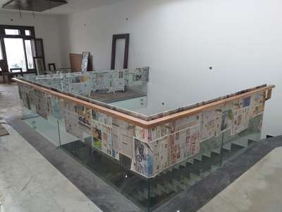 Glass railing with wood handal
