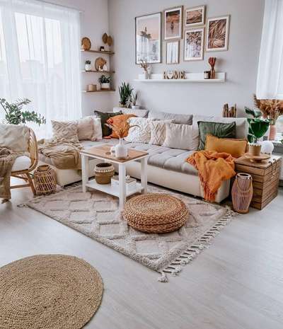 Get this boho look with a woven rectangular carpet ,a small round jute rug, footstool, floating shelves arranged with some pots for indoor plants and wall plates .#interior #decor #ideas #home #interiordesign #indian #colourful#decorshopping