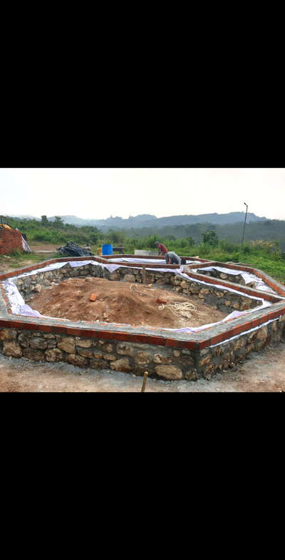 An octagonal shaped cottage under construction
In this construction we used,
Natural stone for foundation
old demolishing bricks for bricks work
provided mud plastering
provided filler slab type concrete
provided brickbat flooring
 #lowcostarchitecture 
 #lowenergybuildings
 #economical 
 #naturefriendly