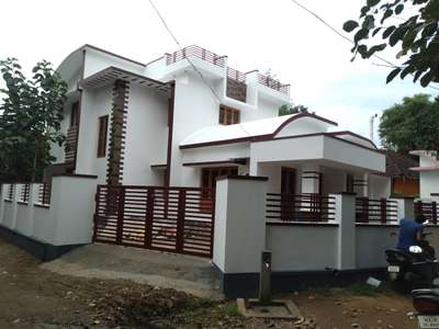 for sale 6.5 cent 1750 sqf 3 BHk living dinning kitchen work area... compound wall.interlock... using all wood teak...At palakkad 60 lack's