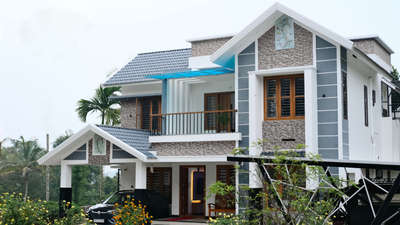 Tropical white and grey themed home in wayanad.
 
 #Architect #Wayanad #ExteriorDesign