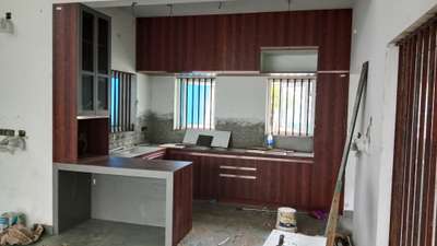 kitchen cupboards 
Elite Builders