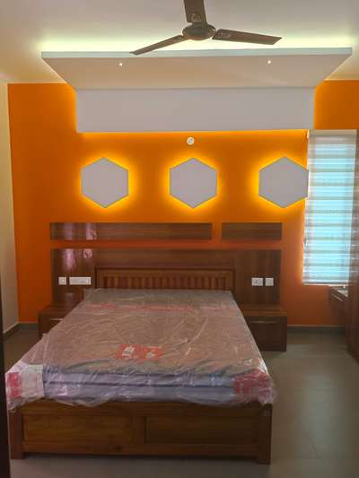 Coat with wood and featuring ample storage, the headboard is tailored to the client's specific requirements, including the color combination as per their instructions