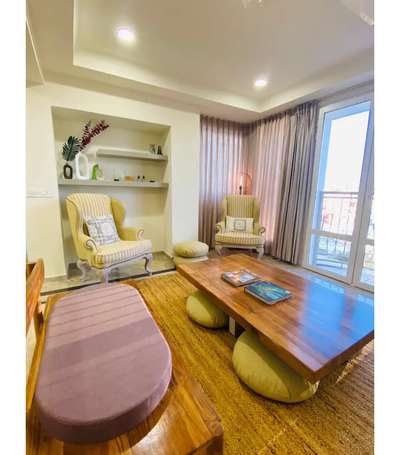 Casual living area with pestal color theme #realsitephotos #exposedbrick #warmambience #pestalcolortheme #cutefurnituredesign