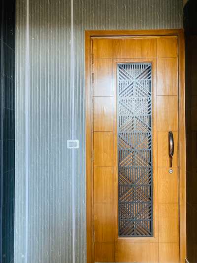 Entrance Door and panelling! 
Divy interiors designed this Beautiful Door #HouseDesigns  #LivingroomDesigns  #Entrance  #best_architect  #happy_client  #HomeDecor  #FrenchDoor  #cncroutercutting