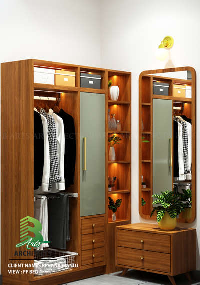 Your daily dose of glam 🌿💫
Elegant wood-toned wardrobes with frosted sliding doors, warm LED shelving, and stylish gold accents — perfectly paired with a mirrored dresser adorned by green potted plants for a fresh, organized bedroom vibe.

Client : Rehana Manoj 
Area : Dressing Area
