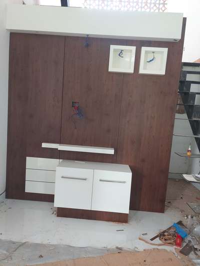 Tv unit in toilet wall