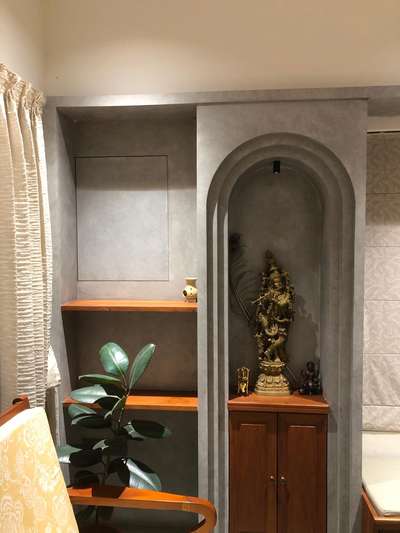 Pooja Space 
tapasarchitects

 #Poojaroom #poojaroomdecor #cementtexture #keralatraditional #contemporary #homedecor #interiorstyling #krishna #arch