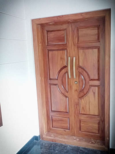 A premium Teak main door 
call 9947624671