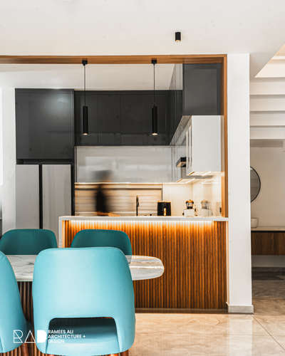Sleek, modern, and minimal — a perfect blend of functionality and aesthetics at nishad house. Warm wooden textures paired with elegant finishes bring a timeless charm to this home.

#raddesign #interiordesign #modernhome #minimalistdesign #homegoals #luxuryliving #kitchendesign #diningspace #contemporaryinteriors #radspaces #designinspiration #rameesali #rameesalidesign #studiorameesali