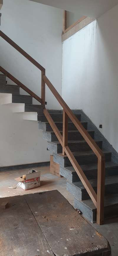 teak wood staircase 
AZ interio kannur