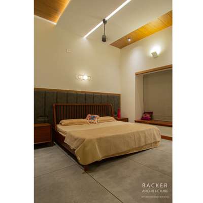 Client :Mr.Sameerlal 
Location : Valanchery, Malappuram 

Designed by : Backer Architecture
Contact us :
+91 9895672926
+91 9447749089
The minimalist interior is characterized by a simple, uncluttered, and functional design that focuses on the essentials. This style typically features a neutral color palette with white, black, and grey tones, and minimal use of decorative accessories.
Furniture pieces in a minimalist streamlined and have clean lines, with a focus on function and simplicity rather than ornamentation. The bed is often the focal point of the room, platform bed with a low profile.
The bedroom interior creates a serene and calming atmosphere, with a focus on the essential elements needed for rest and relaxation.