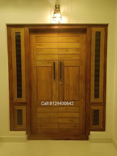 Front double door in teak with 15 years warranty. Doors are also available in Karivaka, Mahogany and Plavu. #TeakWoodDoors #woodendoors #Woodendoor #woodendesign #wooddoors #woodworks #WoodenWindows