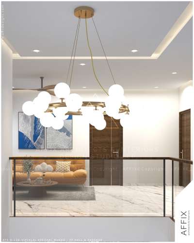 A double-height hall composition defined by warm beige walls, white marble flooring with subtle veining, and rich walnut wood accents. The centrally suspended brass chandelier anchors the space, while the recessed false ceiling with cove lighting enhances depth. A glass balustrade with wooden handrail maintains visual continuity, positioning the seating zone as a refined focal point. #Architect  #architecturedesigns  #Architectural&Interior  #kerala_architecture  #best_architect