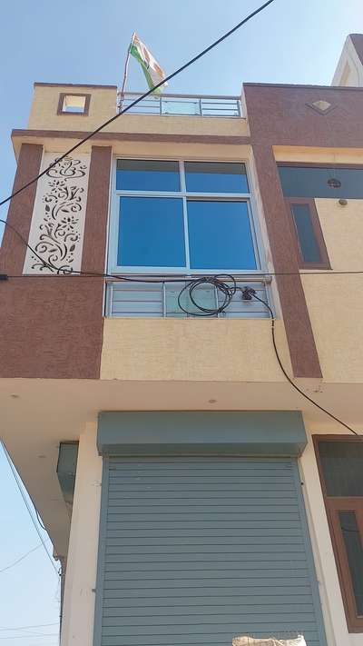 balcony covered by glass with sliding windows.