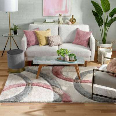 An easy trick to create a designed living space is to match your rug with the sofa, cushions and throw pillows. Top it with an artwork in the same colour scheme. Add towering leafy plants to cosy the space.
#interior #decor #ideas #home #interiordesign #indian #colourful 
#decorshopping