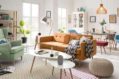 Get this warm and cozy living room in neutral shades with coffee table, ottoman and vases in shades of white. Add mint green statement arm chair, tan sofa and cushions to add a pop of colour to your space. #interior #decor #ideas #home #interiordesign #indian #colourful #decorshopping