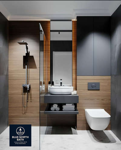 A perfect blend of elegance and utility!
This minimalist bathroom design showcases a modern counter washbasin setup with concealed storage and a wall-mounted WC for a clutter-free look.
The contrasting textures of warm wood panels and matte black fittings add a touch of luxury, while the contemporary shower area keeps things sleek and functional.

✅ Ideal for compact bathrooms
✅ Easy to clean & maintain
✅ Premium look with efficient space use #BathroomDesigns  #BathroomIdeas  #BathroomStorage  #BathroomRenovation  #BathroomFittings  #BathroomCabinet  #bathroominspiration  #_bathroomglasses