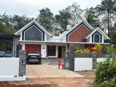 *🏡 Victorian Style 3BHK Home – Kollam District 🏡*

Designed by Engineer KV Muraleedharan – Building Designers.
This 1689 sq.ft elegant home features:
✅ 3 spacious bedrooms
✅ Beautiful water fountain with Buddha statue at the exterior 🌊🪷
✅ Well-maintained garden for a refreshing ambience 🌿🌸
✅ Strong compound wall ensuring safety & privacy 🧱
✅ Classic white & grey exterior finish 🎨